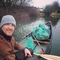 James Elliott (the canoe river cleaner) in his canoe filled with several bags of rubbish picked from the river. 