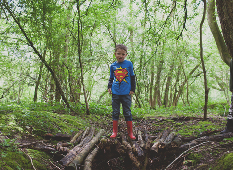 Edward stands on a pile of branches